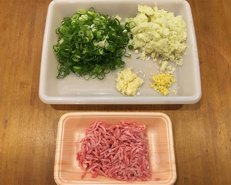 Mince the cabbage, green onion, garlic, and ginger into very small, fine pieces.
